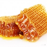 sweet honeycombs with honey, isolated on white